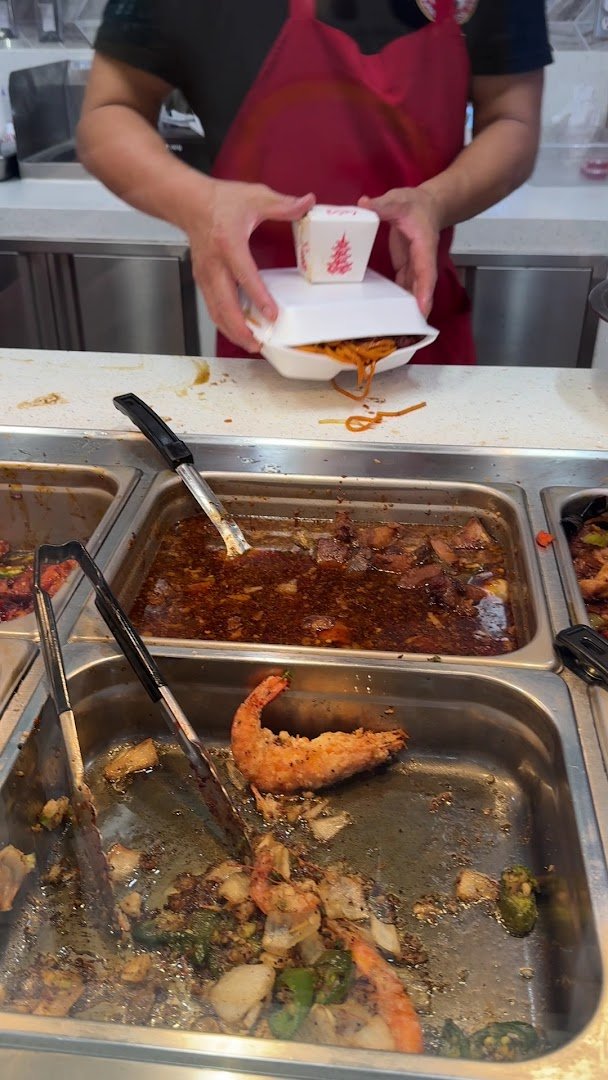 Tray of Chinese takeout with rice and noodles