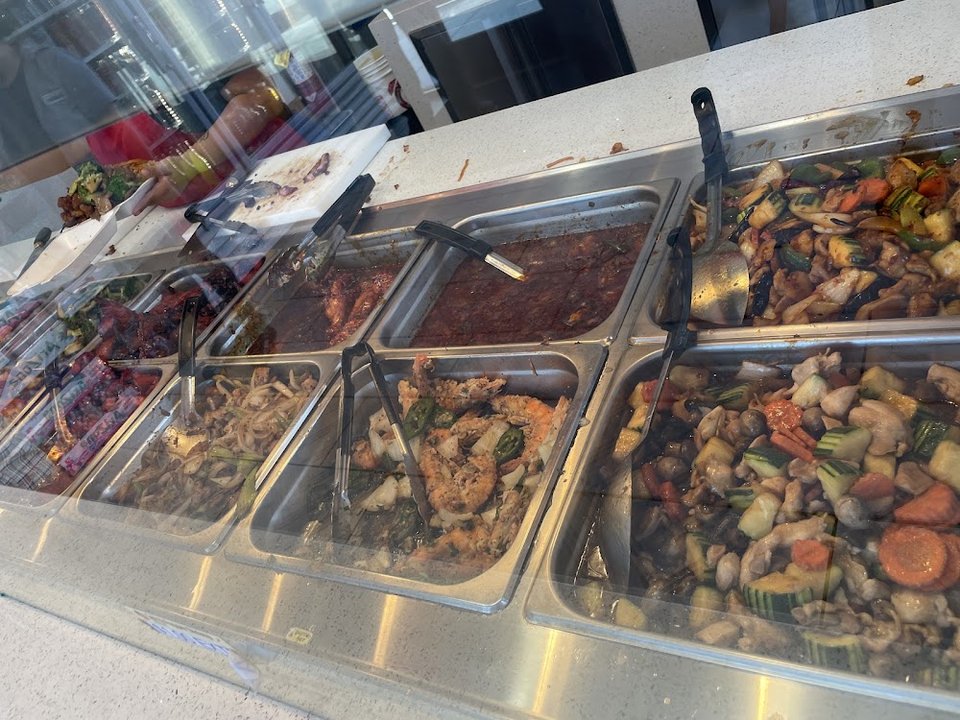 Printed menu with rice, noodles, and chicken dishes